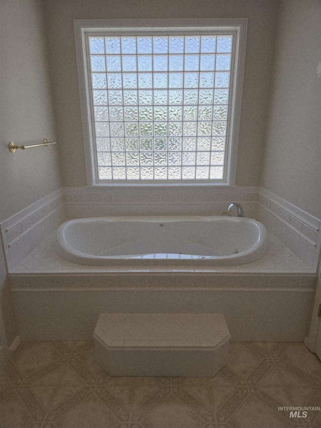1203 Tara Ct, Fruitland, ID 83619 - full bath featuring a garden tub and tile patterned floors