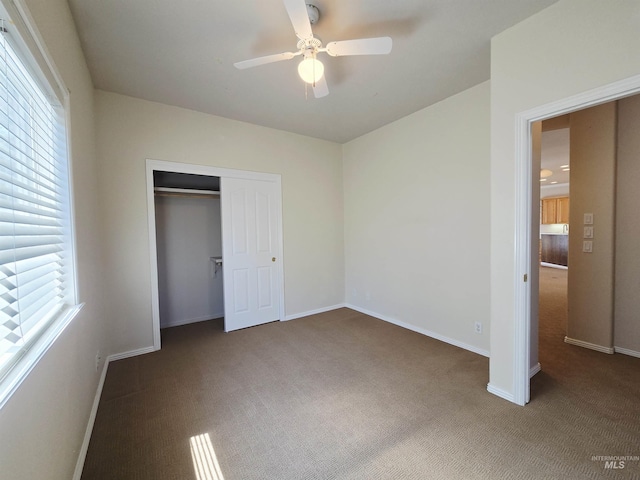 1203 Tara Ct, Fruitland, ID 83619 - unfurnished bedroom featuring carpet flooring, a ceiling fan, baseboards, and a closet