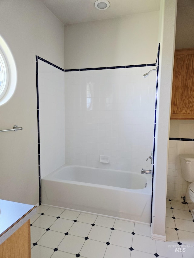 1203 Tara Ct, Fruitland, ID 83619 - full bath featuring vanity, tile patterned floors, toilet, and bathing tub / shower combination