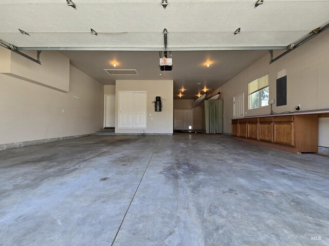 1203 Tara Ct, Fruitland, ID 83619 - garage featuring a garage door opener and electric panel