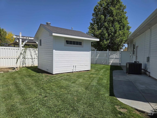 1203 Tara Ct, Fruitland, ID 83619 - exterior space with a fenced backyard, an outbuilding, central AC, and a patio