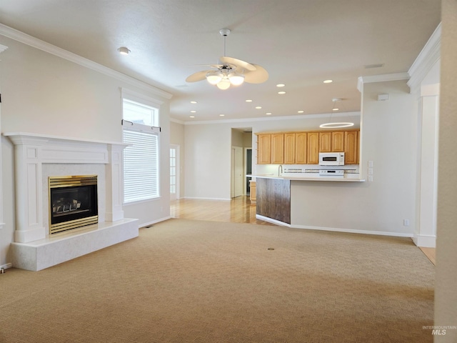 1203 Tara Ct, Fruitland, ID 83619 - unfurnished living room featuring crown molding, a ceiling fan, baseboards, and light carpet