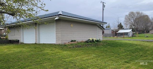 view of home's exterior featuring an outdoor structure, solar panels, a yard, and metal roof
