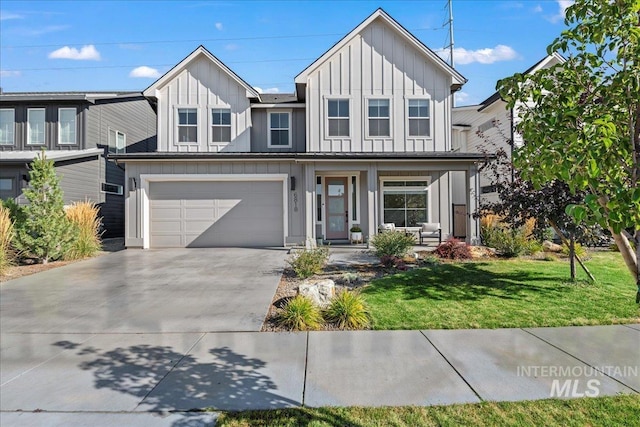 view of front of home with a garage, a front lawn, and a porch