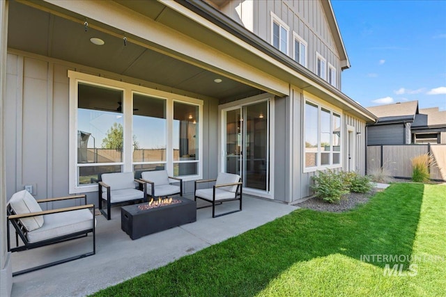 view of patio / terrace with an outdoor living space with a fire pit