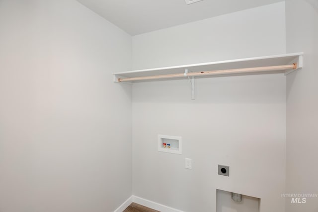 laundry room featuring hookup for a washing machine, electric dryer hookup, and wood-type flooring