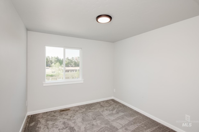 empty room featuring carpet flooring