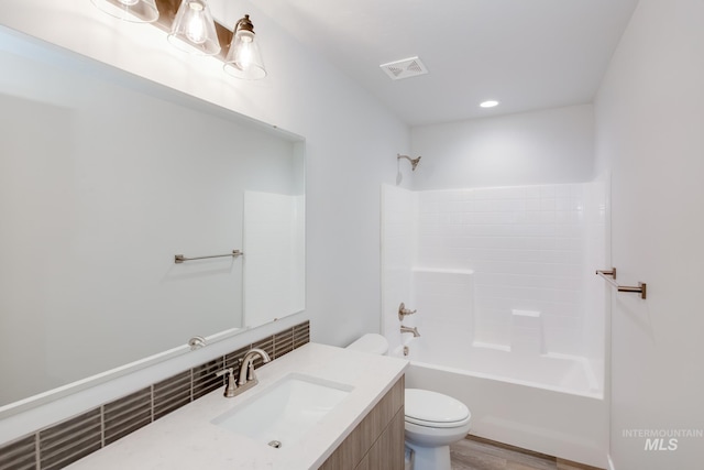 full bathroom featuring shower / bathtub combination, toilet, and vanity