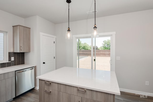 kitchen featuring light brown cabinetry, dishwasher, decorative light fixtures, tasteful backsplash, and dark hardwood / wood-style floors