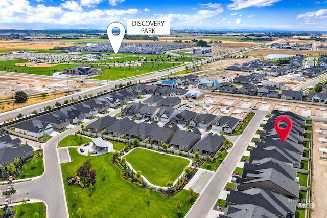 birds eye view of property with a residential view