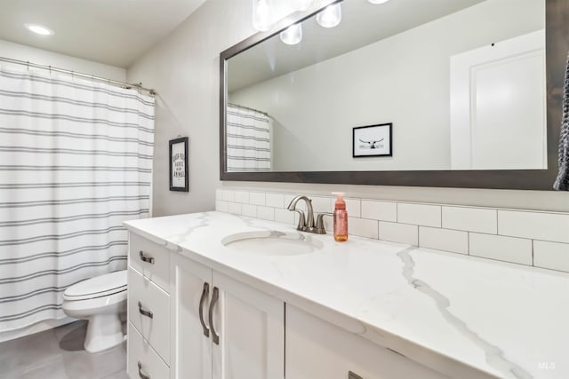 9115 S Palena Ave, Kuna, ID 83634 - bathroom with vanity, toilet, tasteful backsplash, recessed lighting, and tile patterned flooring