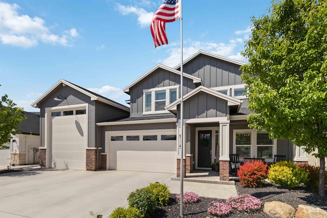 9115 S Palena Ave, Kuna, ID 83634 - craftsman-style home with board and batten siding, brick siding, driveway, a porch, and an attached garage