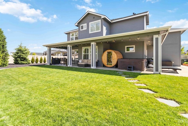 9115 S Palena Ave, Kuna, ID 83634 - rear view of house featuring a hot tub, a patio area, and an outdoor living space