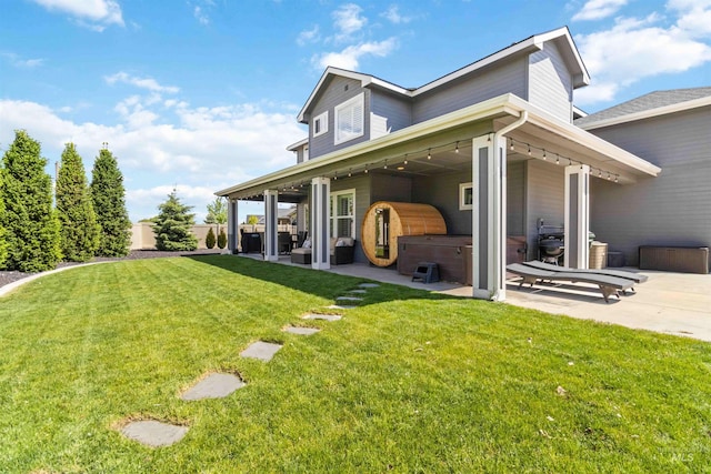 9115 S Palena Ave, Kuna, ID 83634 - back of house with a hot tub and a patio area