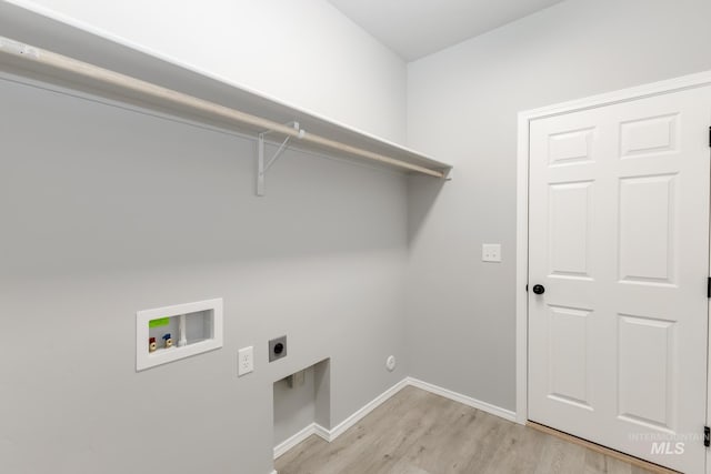 laundry area featuring hookup for a washing machine, light wood-style flooring, hookup for an electric dryer, laundry area, and baseboards