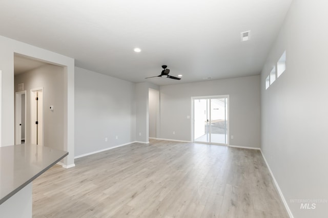 spare room with recessed lighting, visible vents, light wood-style flooring, ceiling fan, and baseboards