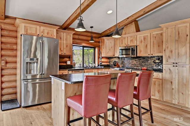10 Daggett Rim, Boise, ID 83716 - kitchen featuring stainless steel appliances, rustic walls, light brown cabinetry, dark countertops, and light wood-style floors