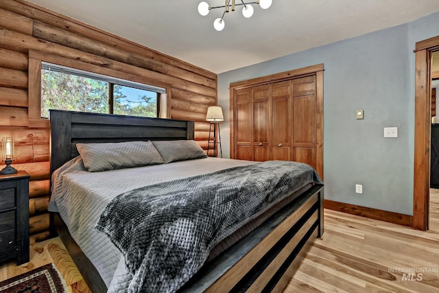 10 Daggett Rim, Boise, ID 83716 - bedroom with rustic walls, baseboards, light wood-type flooring, and a closet