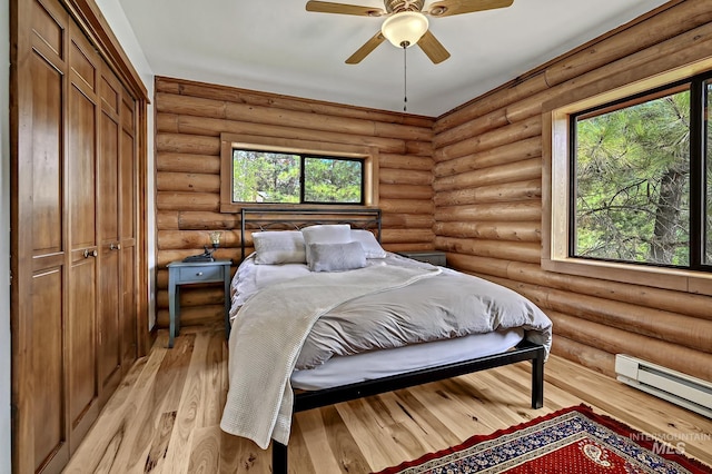 10 Daggett Rim, Boise, ID 83716 - bedroom featuring a baseboard radiator, multiple windows, light wood finished floors, and a closet