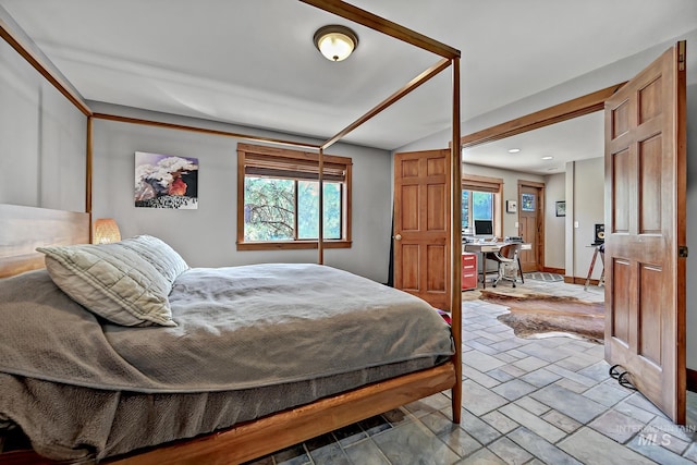 10 Daggett Rim, Boise, ID 83716 - bedroom featuring stone tile floors, an office area, baseboards, and recessed lighting