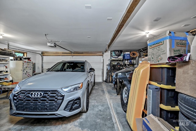 10 Daggett Rim, Boise, ID 83716 - garage with freestanding refrigerator and a garage door opener