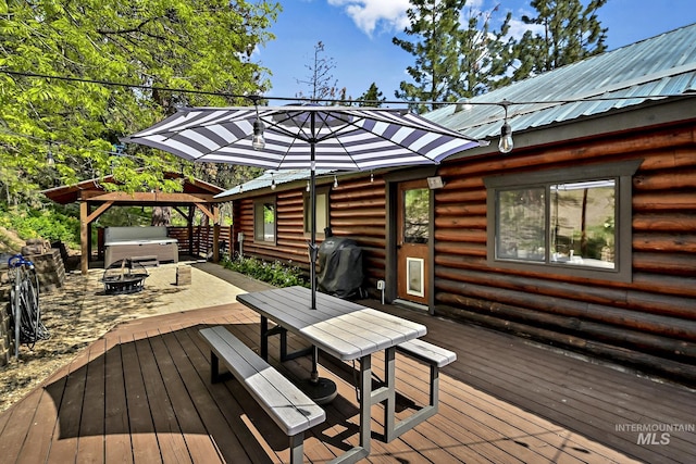 10 Daggett Rim, Boise, ID 83716 - deck featuring a hot tub, a fire pit, grilling area, a gazebo, and outdoor dining space