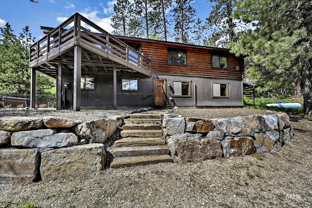 10 Daggett Rim, Boise, ID 83716 - back of house featuring a wooden deck and log exterior