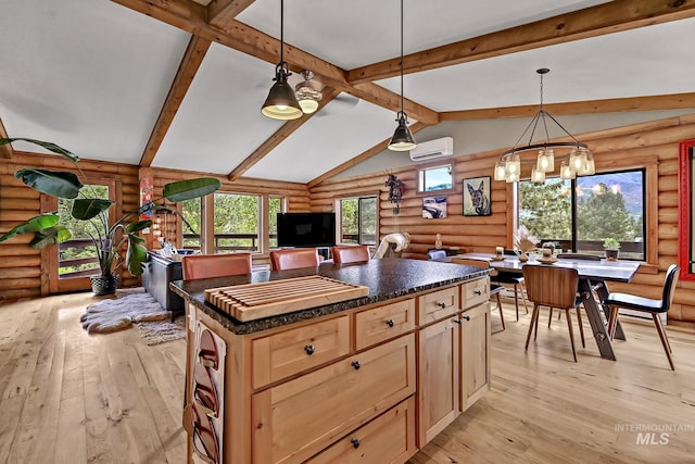 10 Daggett Rim, Boise, ID 83716 - kitchen featuring log walls, a wall unit AC, dark countertops, light wood-style floors, and a chandelier