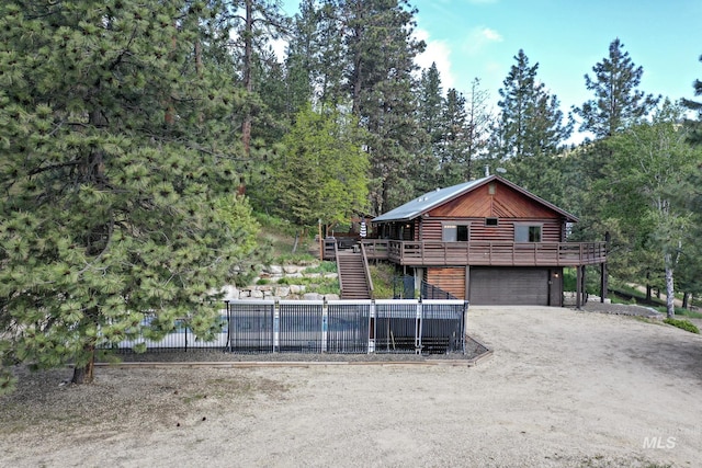 10 Daggett Rim, Boise, ID 83716 - view of front of property with stairway, a deck, an attached garage, and driveway