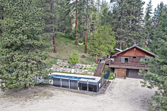 10 Daggett Rim, Boise, ID 83716 - view of front facade with a deck, stairway, and driveway