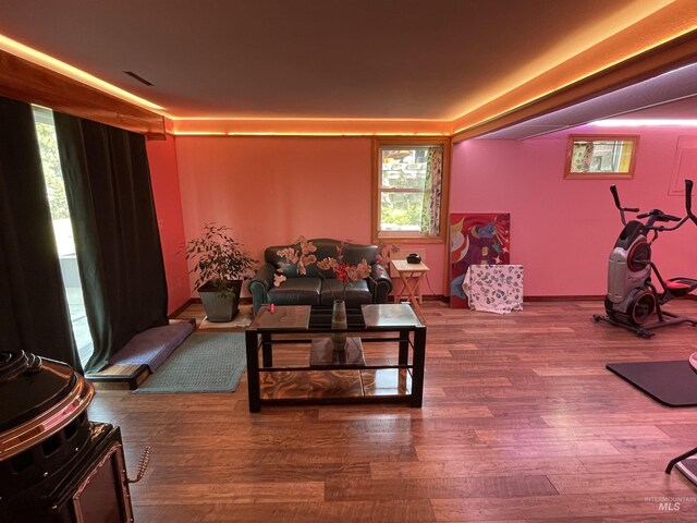 living area with wood finished floors and visible vents