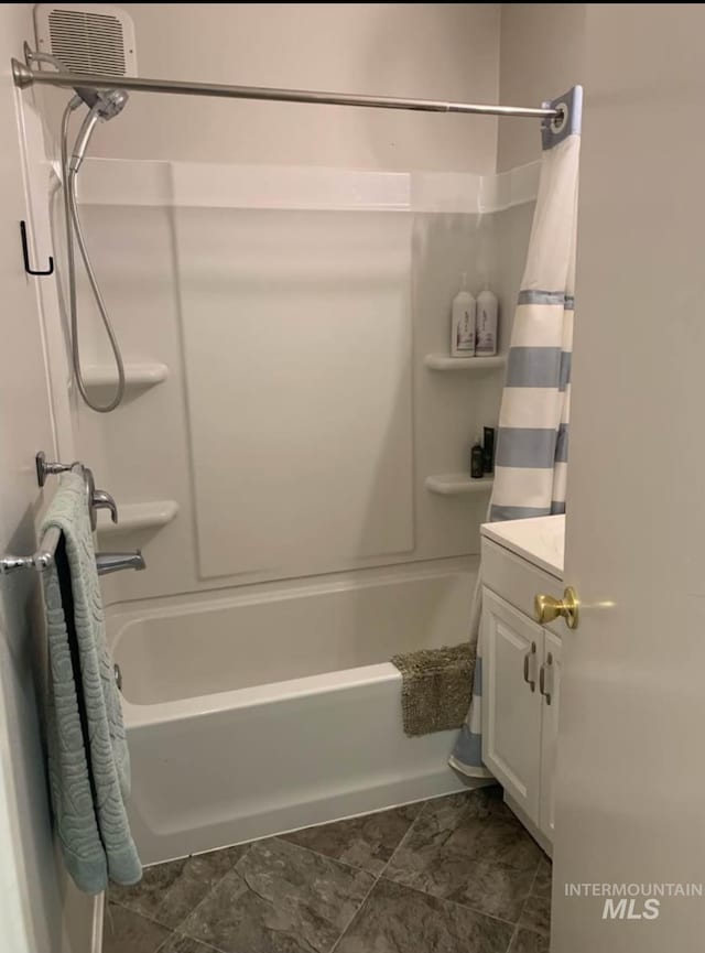 bathroom with vanity and shower / bathtub combination with curtain