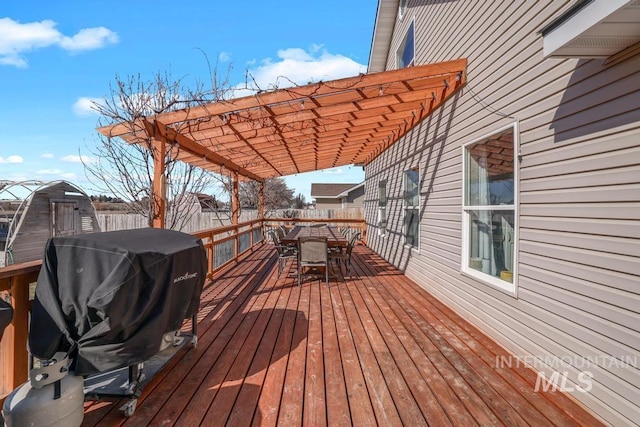1003 Lauren Ln, Filer, ID 83328 - deck featuring outdoor dining space, area for grilling, fence, and a pergola