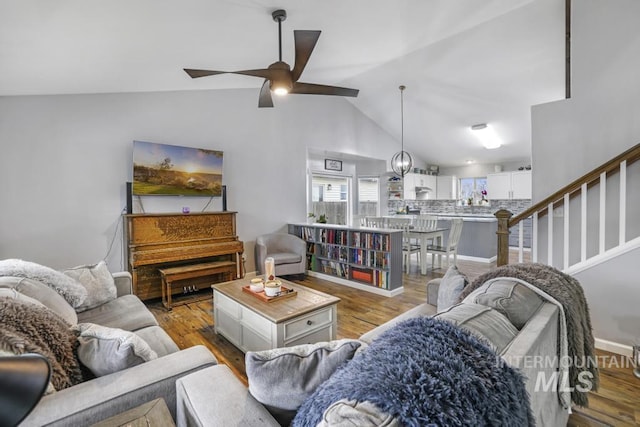1003 Lauren Ln, Filer, ID 83328 - living room featuring stairs, lofted ceiling, wood finished floors, and ceiling fan