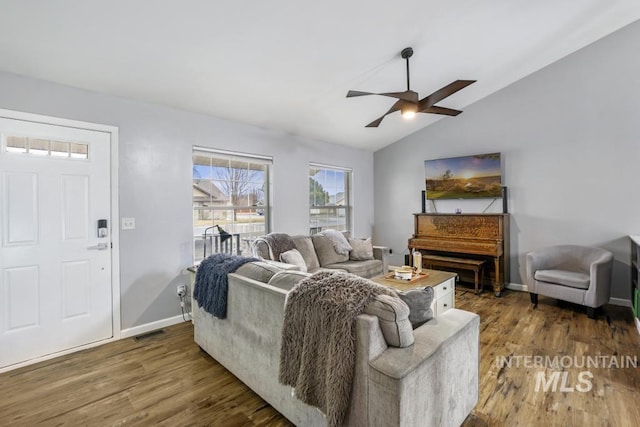 1003 Lauren Ln, Filer, ID 83328 - living area featuring visible vents, wood finished floors, baseboards, ceiling fan, and vaulted ceiling