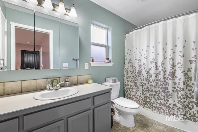 1003 Lauren Ln, Filer, ID 83328 - full bath featuring vanity, toilet, and a shower with curtain