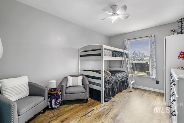 1003 Lauren Ln, Filer, ID 83328 - bedroom with ceiling fan, baseboards, and wood finished floors