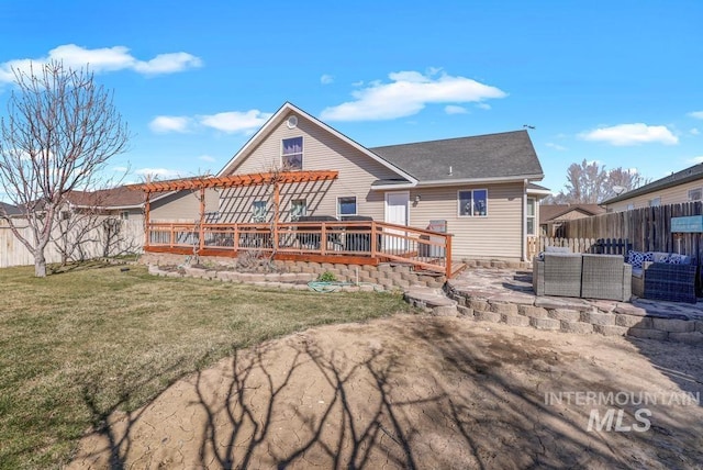 1003 Lauren Ln, Filer, ID 83328 - rear view of property with a deck, a yard, a fenced backyard, and outdoor lounge area