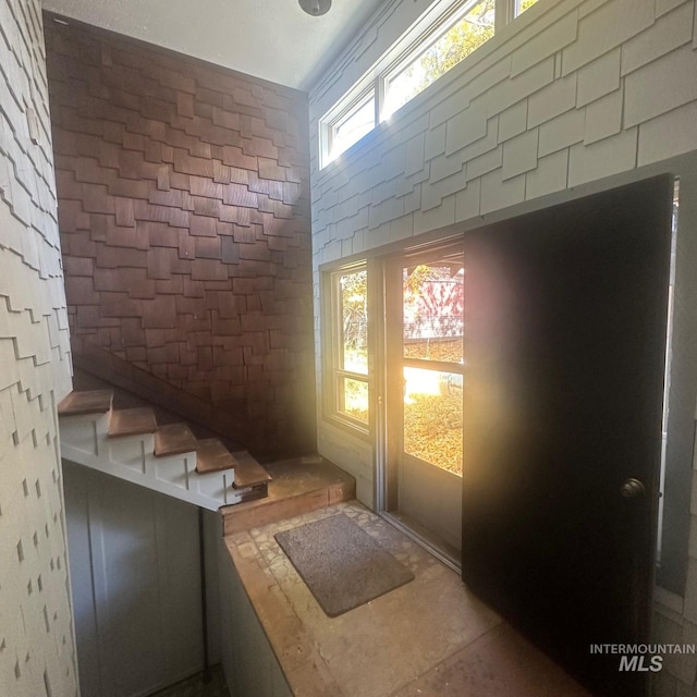 interior space featuring brick wall