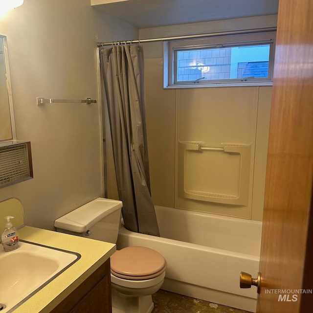 full bathroom featuring toilet, vanity, and shower / bathtub combination with curtain