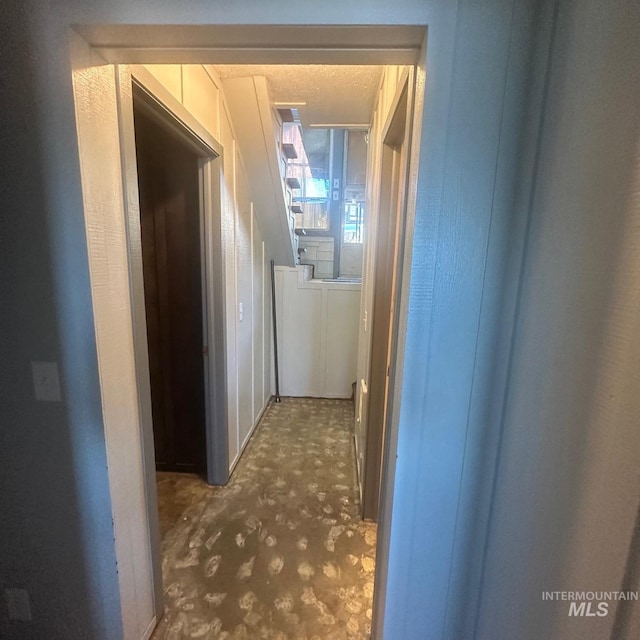 corridor with a textured ceiling