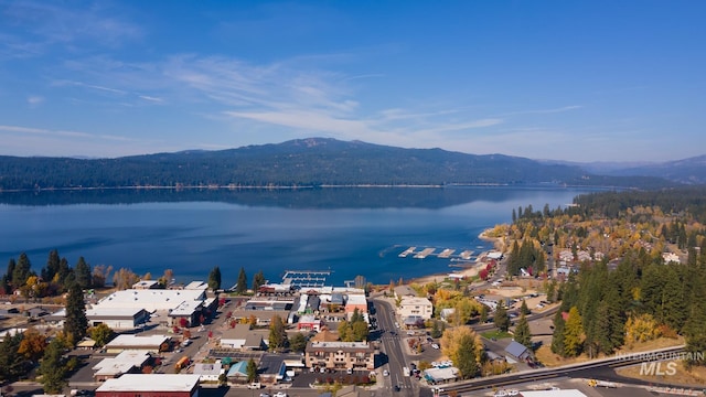 aerial view featuring a water and mountain view