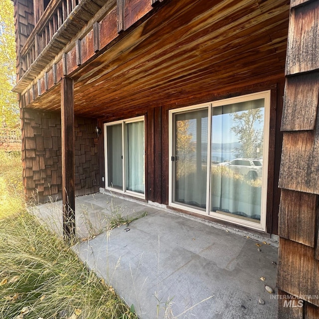 doorway to property featuring a patio area