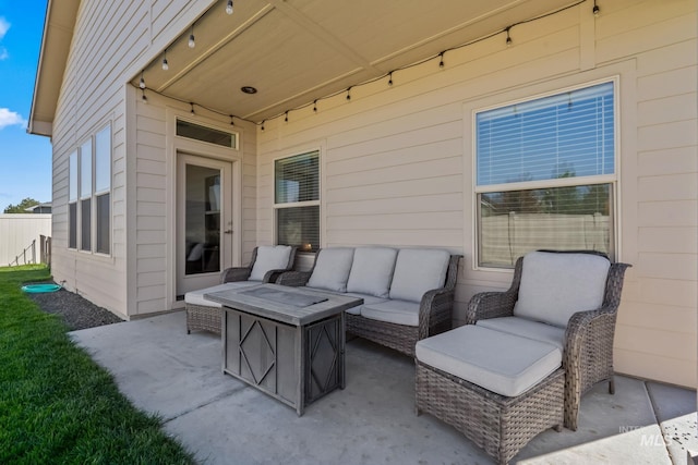 view of patio / terrace featuring an outdoor living space with a fire pit