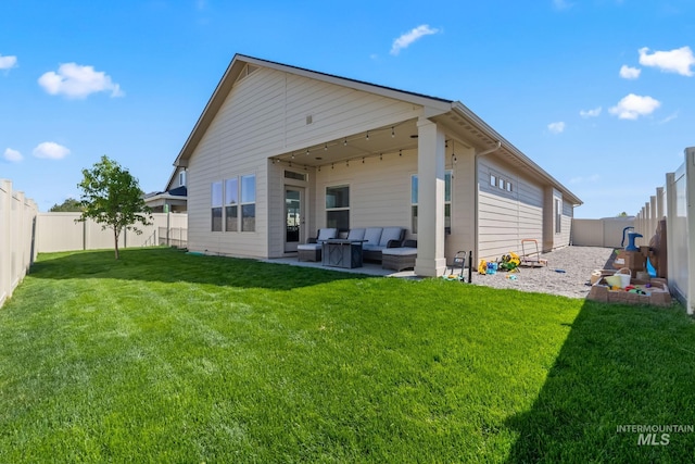 back of property featuring outdoor lounge area and a patio area