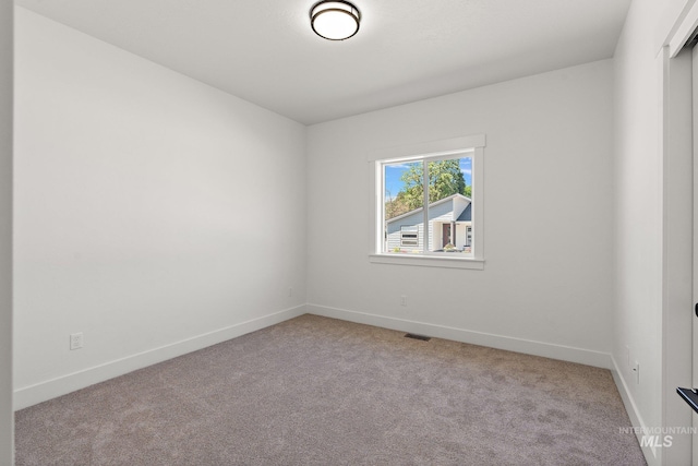 view of carpeted spare room