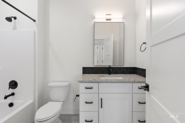 full bathroom featuring shower / bathing tub combination, vanity, and toilet