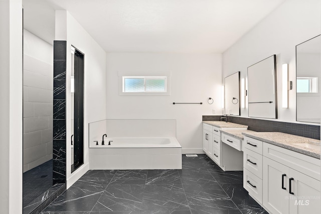 bathroom with vanity and plus walk in shower