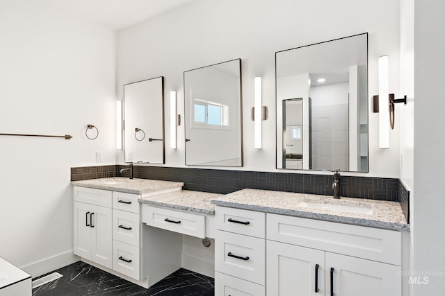 bathroom featuring vanity, a shower, and tasteful backsplash