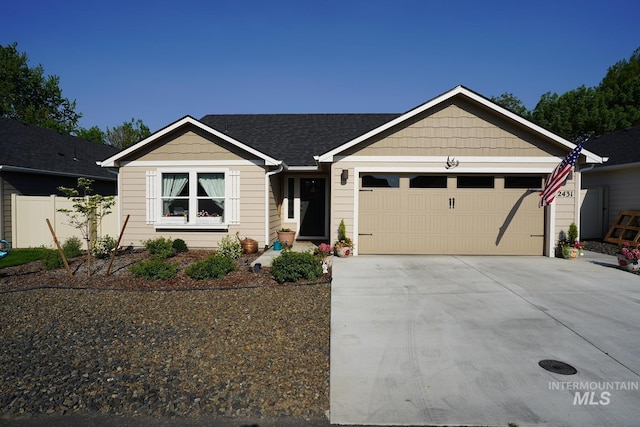 2431 Legacy Ct, Clarkston, WA 99403 - ranch-style house with a garage, driveway, fence, and a shingled roof